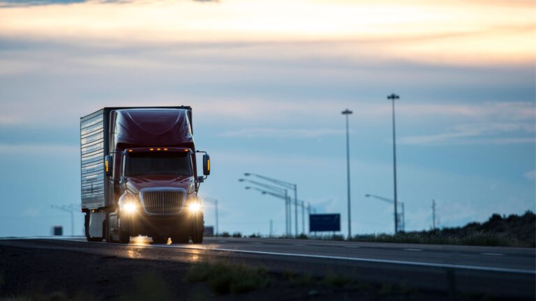 Truck on a highway at sunset